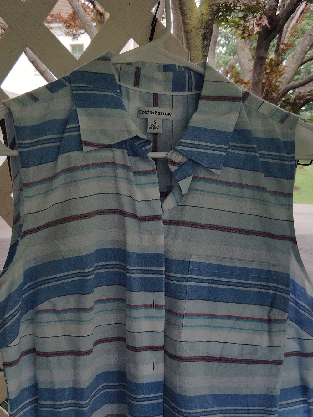 Sleeveless top with pocket button down. Transitional for summer to Fall or sprin